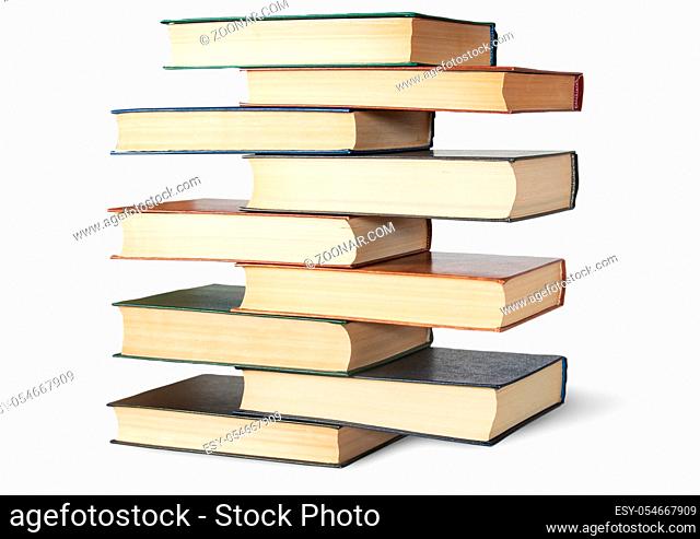 Vertical stack in old books rotated isolated on white background