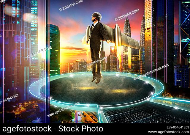 Businessman wear a rocket suit to lift , round stage floating with city skyline background , Business start up success concept