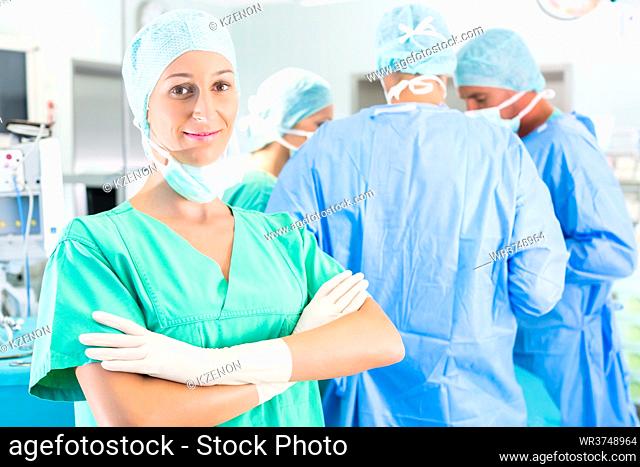 Hospital - surgery team in the operating room or Op of a clinic operating on a patient in emergency