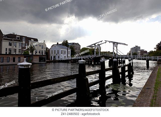 Rembrandtbrug over the galgewater in the city of Leiden, Netherlands with cloudy weather