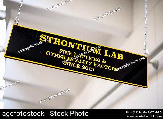 21 December 2021, Bavaria, Garching: The words ""Strontium Lab"" can be seen on a sign above the entrance to the strontium laboratory at the Max Planck...