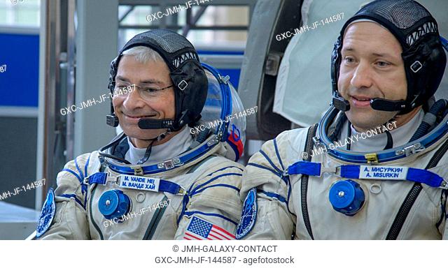 Expedition 52 backup crew members: NASA astronaut Mark Vande Hei, left, and Russian cosmonaut Alexander Misurkin of Roscosmos are seen as they answer questions...