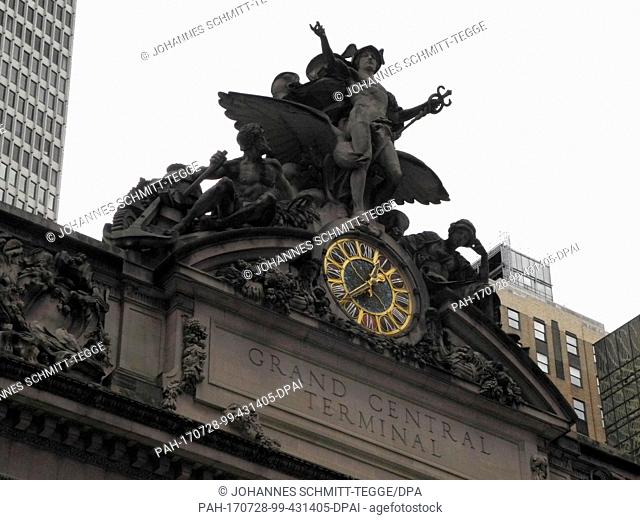The main clock and sculptural embellishments on the facade of Grand Central Terminal train station in New York, USA, 26 July 2017