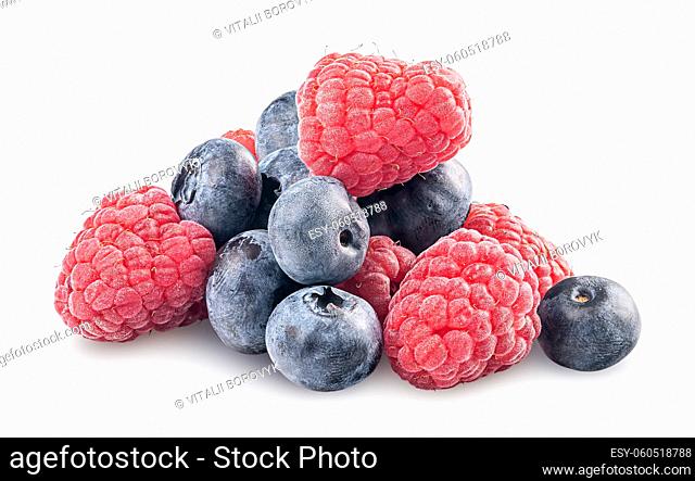 Heap of raspberries and blueberries isolated on white background