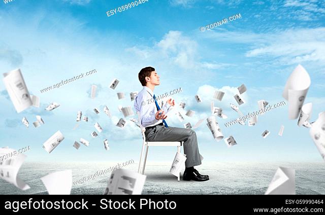 businessman sitting on an office chair, meditation and calmness
