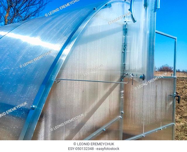 Greenhouse for vegetables. Polycarbonate greenhouse assembled from parts, prefabricated greenhouse