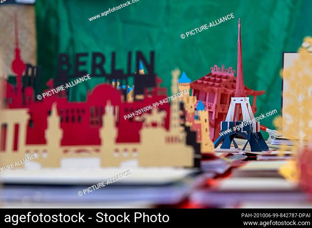 06 October 2020, Berlin: The Eifel Tower as a folding card is offered at a stand at the market on the Maybachufer in Berlin-Kreuzberg
