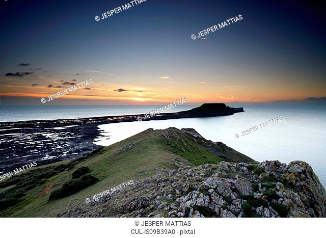 View of Worm's Head at sunset, Rhossili bay, Gower, Wales