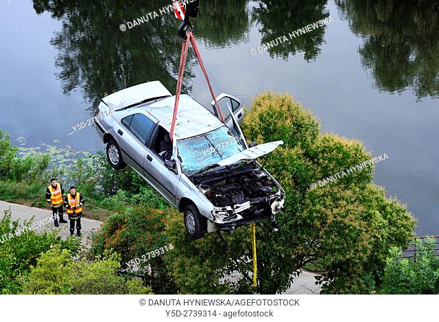 crane lifting crashed car over Isle River, Perigueux, Dordogne, Aquitaine, France , Europe