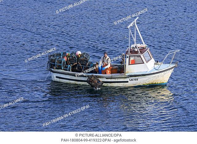 14 June 2018, United Kingdom, Scotland: A fishing boat is out on the Atlantic Ocean, fishing for lobsters around the Shetland Islands