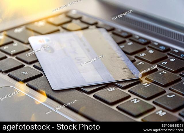 Credit card on computer keyboard symbolising online banking or shopping