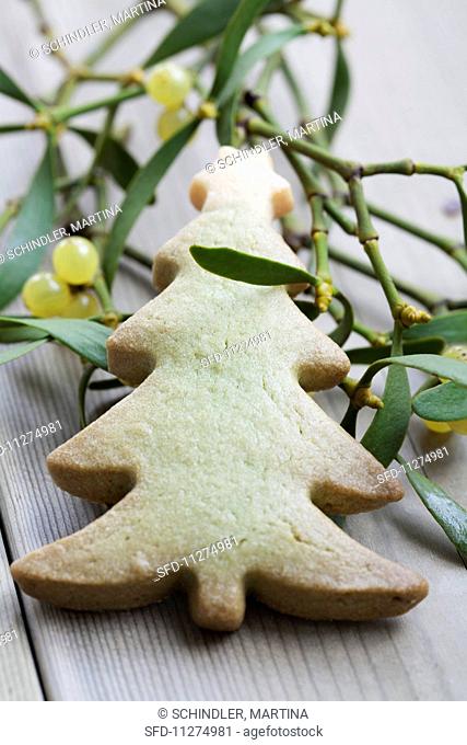 A Christmas tree biscuit and a sprig of mistletoe