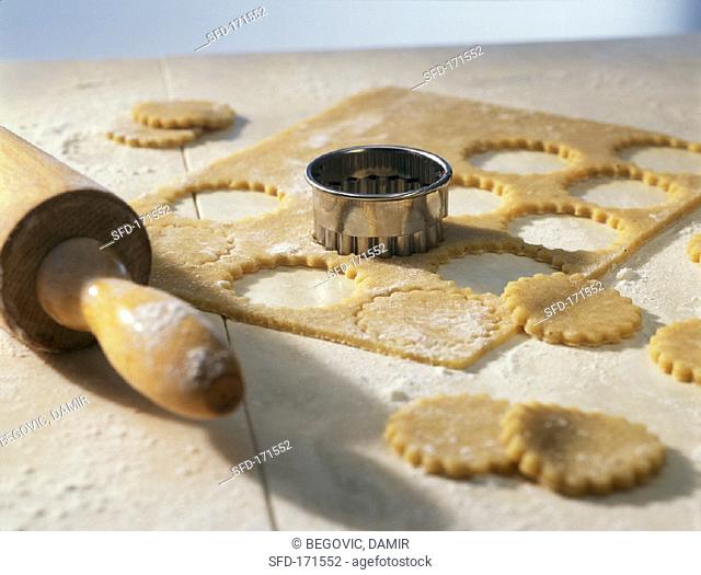 Biscuit dough with biscuit cutter and rolling pin