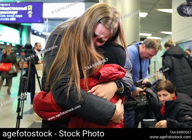 RUSSIA, MOSCOW - DECEMBER 19, 2023: Alexandra Zhulina hugs her son who has arrived on an Istanbul-Moscow flight, at Vnukovo International Airport