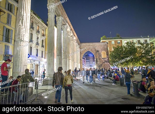 MILAN, ITALY - SEPTEMBER 2015: Tourists and locals enjoy night life near San Lorenzo Columns