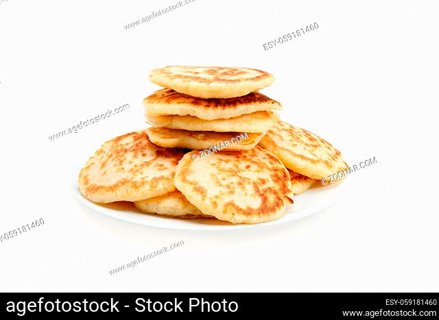Stack of pancakes with strawberry jam. Isolated at white background