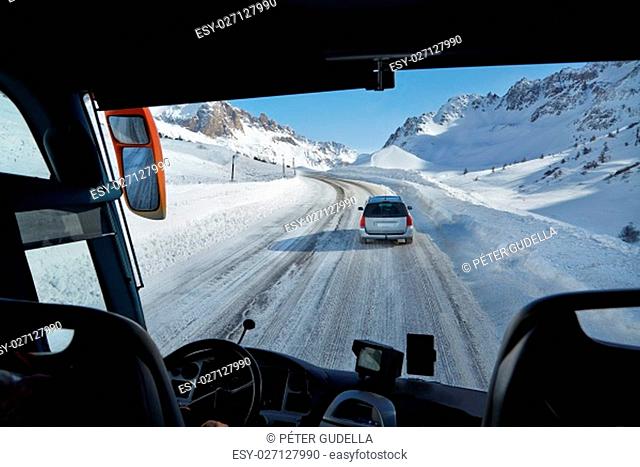 Bus journey in blizzard on an alpine road