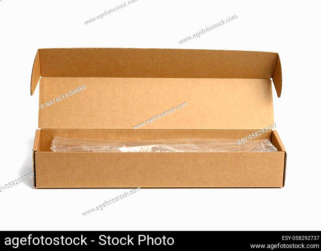 narrow rectangular open cardboard box isolated on white background, close up