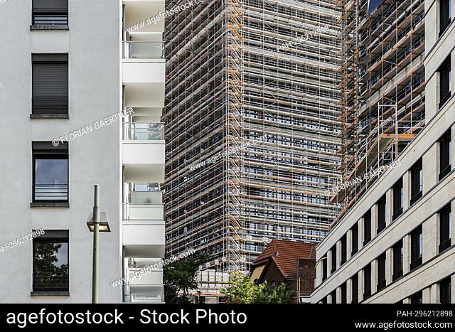 A scaffolded new building stands out between two completed buildings in Berlin, June 26, 2022. - Berlin/Deutschland
