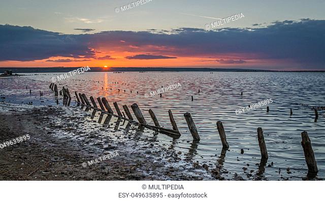 Sunset on the salty estuary Kuyalnik, dead lake near Odessa, Ukraine