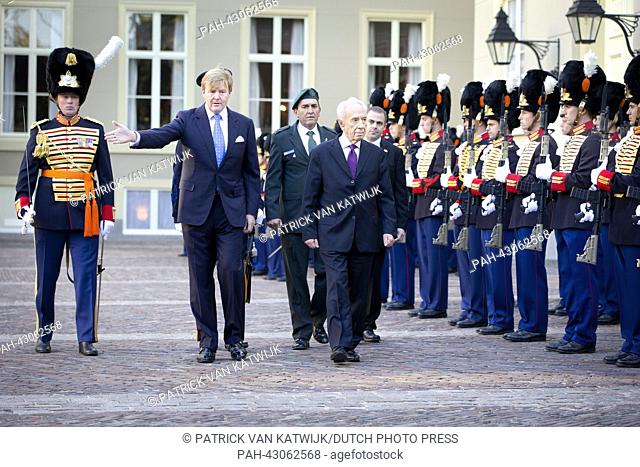 King Willem-Alexander of the Netherlands (L) recieves Israeli president Schimon Peres at Palace Noordeinde during his official visit to the Netherlands in The...