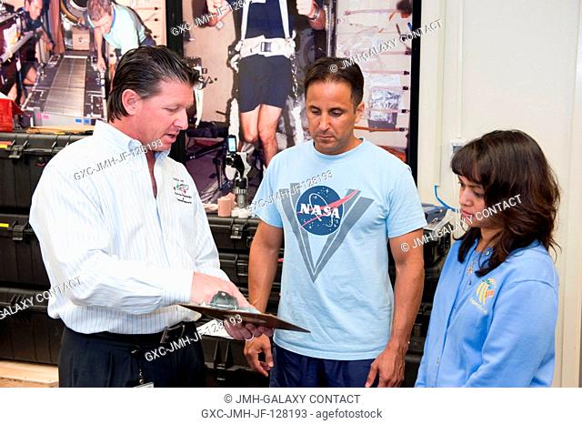 NASA astronaut Joe Acaba (center), Expedition 3132 flight engineer, participates in a treadmill kinematics baseline data collection session in the Planetary and...