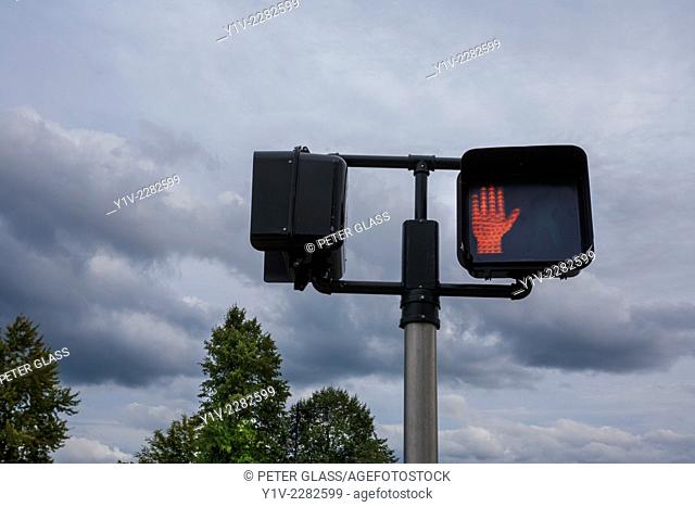 Pedestrian crossing light showing a red hand