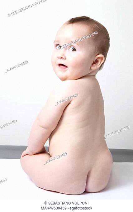 naked baby girl sitting