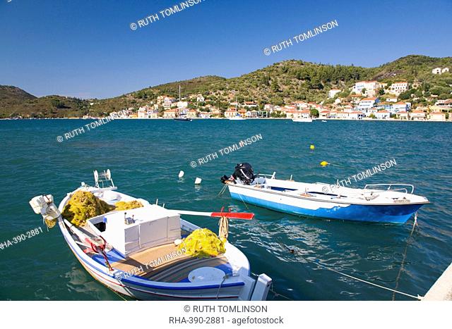View across the harbour, colourful fishing boat in foreground, Vathy (Vathi), Ithaca (Ithaki), Ionian Islands, Greek Islands, Greece, Europe