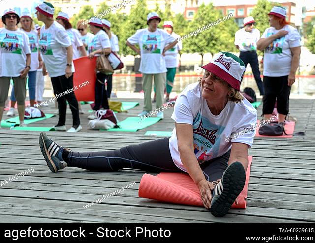 RUSSIA, MOSCOW - JULY 4, 2023: Senior citizens take part in a sports event held in Krymskaya Embankment in Muzeon Park as part of the Moscow Longevity project