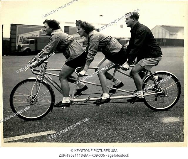 Nov. 13, 1953 - Cycle And Motor Cycle Show Preview 'Bicycle Made For Three': Photo shows Trying out a Bicycle made for three- at the press preview of the Cycle...