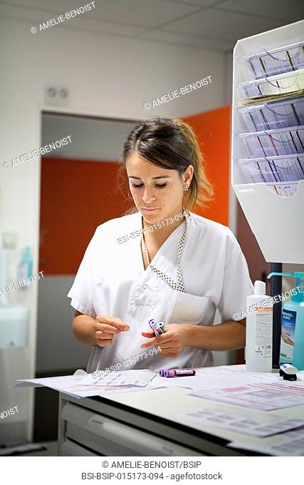 Reportage in the pediatric emergency unit in a hospital in Haute-Savoie, France. A nurse prepares blood sample tubes before sending them off to the lab