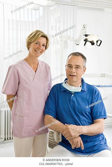 Portrait of a male dentist and assistant
