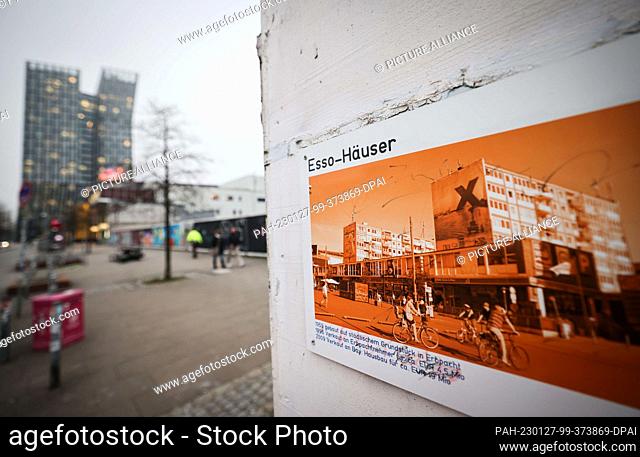 PRODUCTION - 25 January 2023, Hamburg: A photo of the former Esso houses hangs on the closed ""Planbude"" information booth next to the derelict site of the...