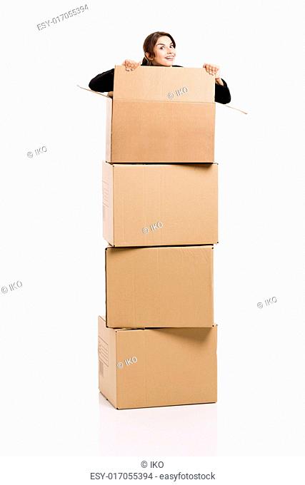 Happy business woman appear inside big card boxes, isolated over white background