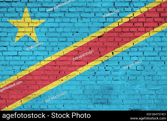 Democratic Republic of the Congo flag is painted onto an old brick wall