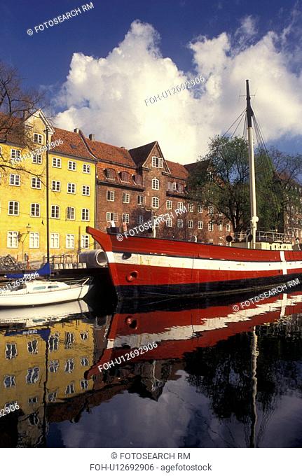 Copenhagen, Denmark, Scandinavia, Sjaelland, Europe, Large red and white sailboat (flagship) docked along a canal in the scenic city of Copenhagen