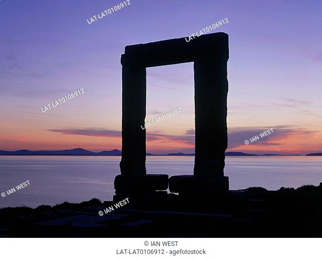 Cyclades island. Temple of Apollo. Ariadne's Arch. Palatia islet. Sunset. Silhouette of arch