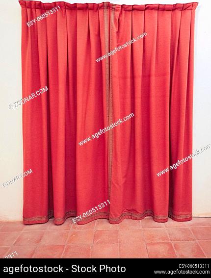 red curtain as in theatre entrance door useful as a background