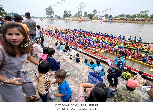 the tradititional Longboat Race at the Mun river of the town of Satuek north of the city Buri Ram in Isan in Northeast thailand