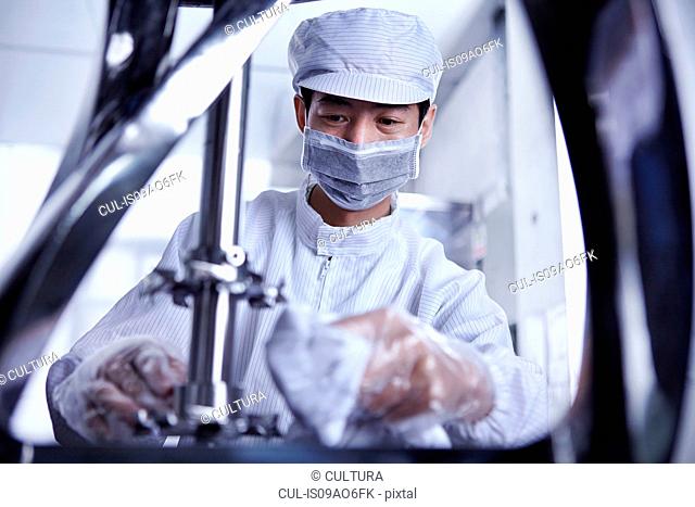 Worker at e-cigarettes battery factory, Guangdong, China