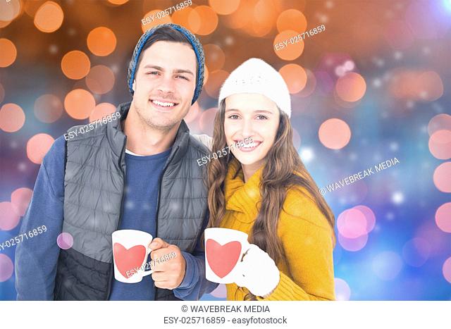 Composite image of smiling couple holding mug