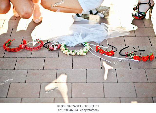 Wreath of girls on bachelorette party on pavement