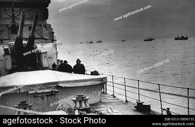 The Nation's Watchdogs: Dusk fells as a convey with escorting vessels comes safely into harbour.""Above all"", said Mr. Churchill in a recent speech