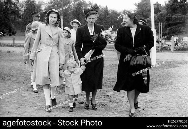 Crown Prince Carl Gustav with mother Sibylla and big sister Margaretha, Stockholm, 1947. Creator: Unknown