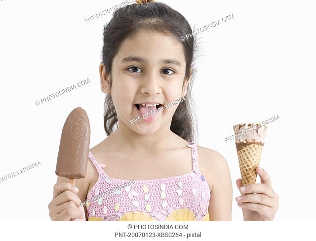 Portrait of a girl holding an ice cream cone and a chocolate ice cream