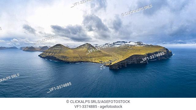 Aerial panoramic view of Eysturoy island from the sea in front of Gjogv village (Faroe Islands, Denmark)