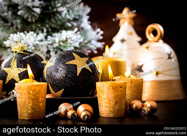 Christmas balls with candles in golden tone