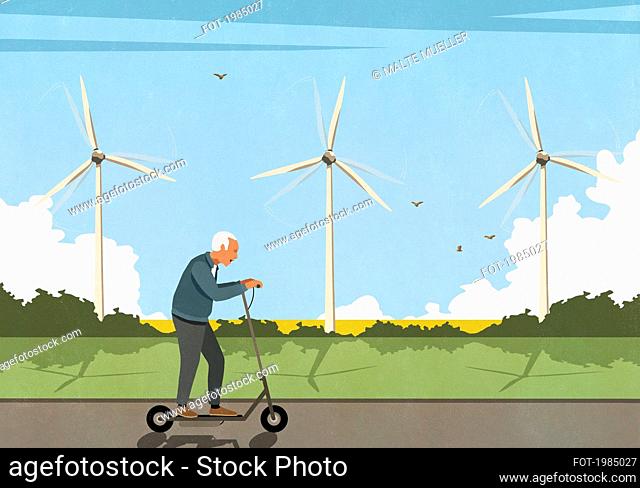 Senior man riding electric push scooter along wind turbines in field