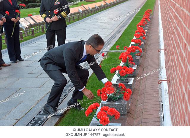 Prime Expedition 53-54 crewmember and NASA astronaut Joe Acaba lays flowers at the Kremlin Wall in Moscow where Russian space icons are interred as part of...